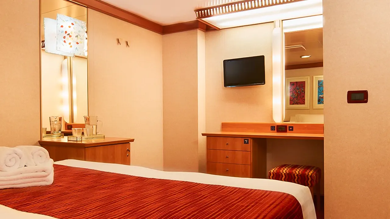 Favolosa Costa Favolosa: Luxurious cruise ship with elegant décor, comfortable cabins, and balconies. Offers premium services and modern amenities.